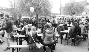 Crowds of shoppers at community market on Roman Road East London