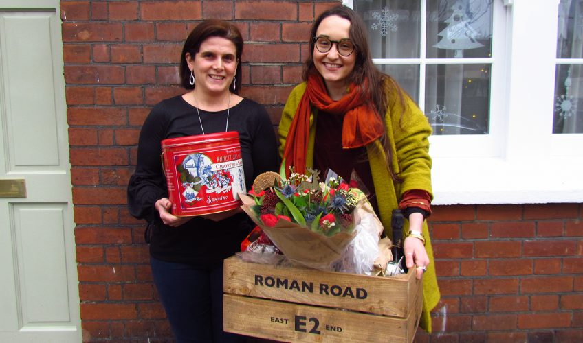 Winner receiving prize of Roman Road E2 Christmas Hamper